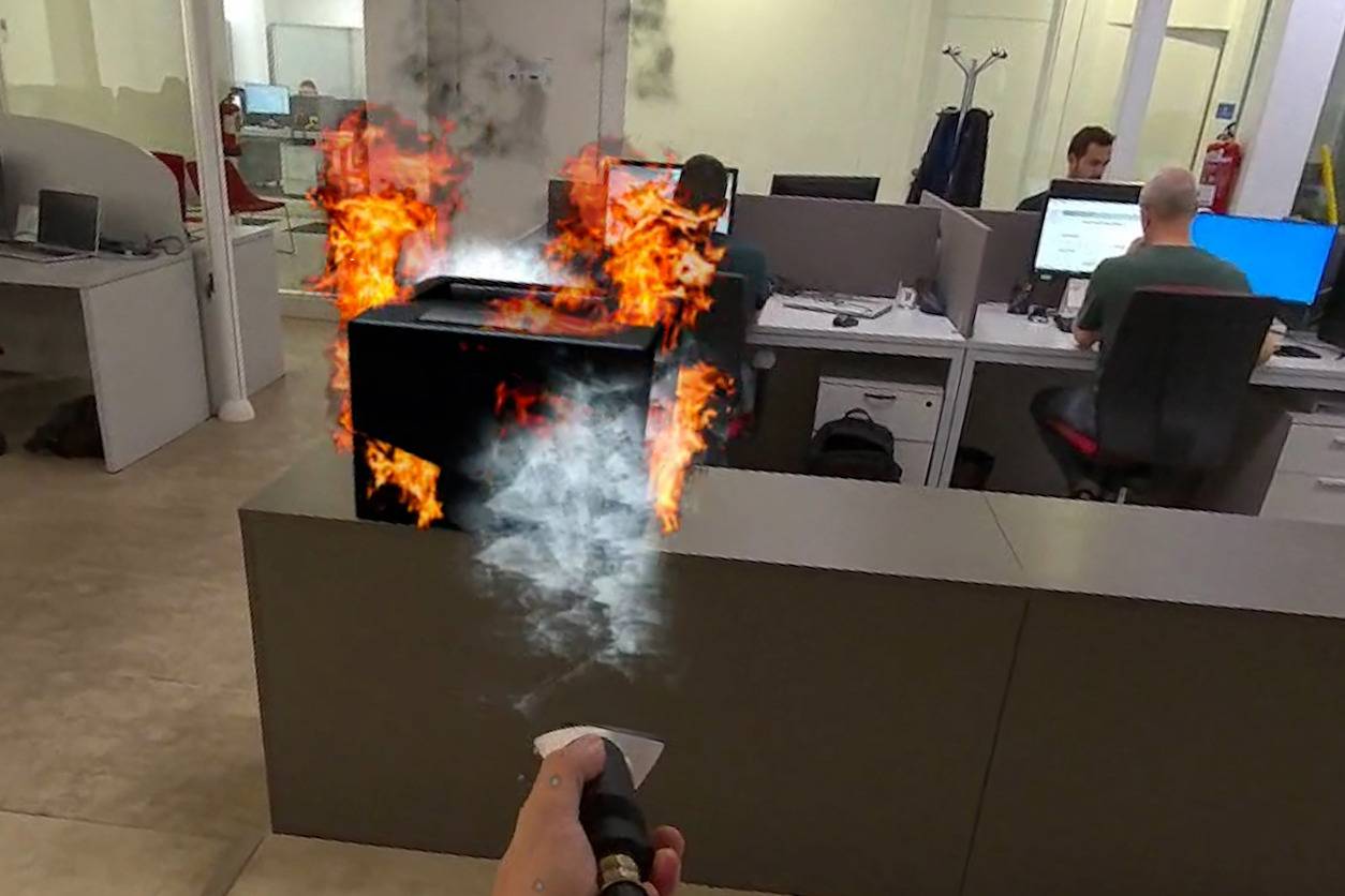 Fire extinguisher training with augmented reality in an office environment.
